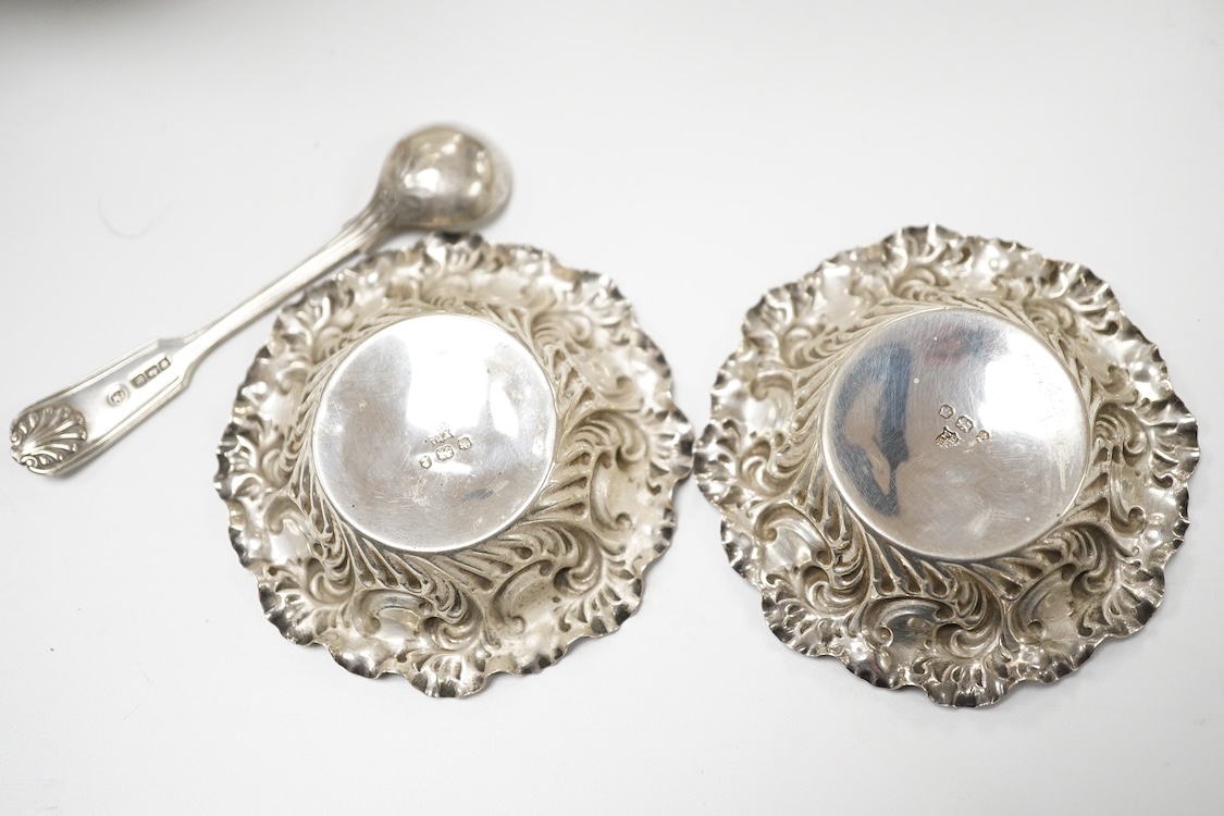 A late Victorian silver boat shaped sugar basket, by Thomas Bradbury & Sons, London, 1896, length 13.2cm, together with a pair of late Victorian repousse silver nut dishes and a silver condiment spoon. 4.8oz.